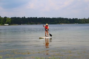 Glenice on Stand Up Paddle Board wearing Aqua Case
